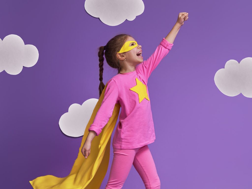Photo of a girl pretending to be a superhero